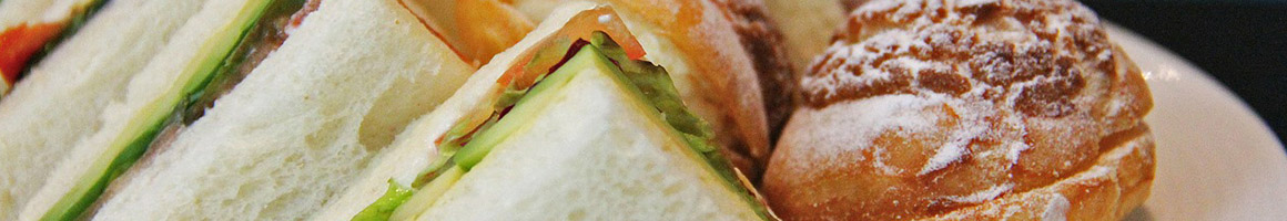 Eating Greek Hot Dog Sandwich at Louie's Coney Island restaurant in Kokomo, IN.